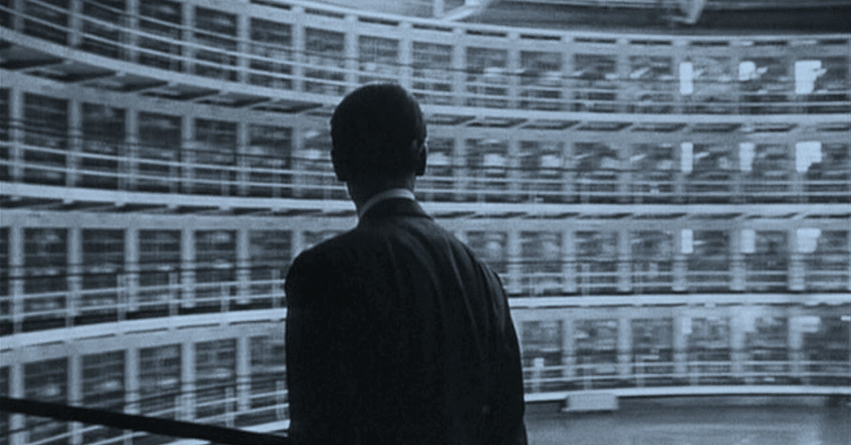 A man staring at rows of windows