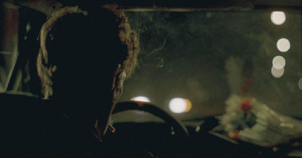 Driving through the night on a dark street.