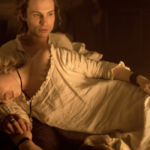 Dangerous Liaisons- a man carrying a woman who looks to have fainted.